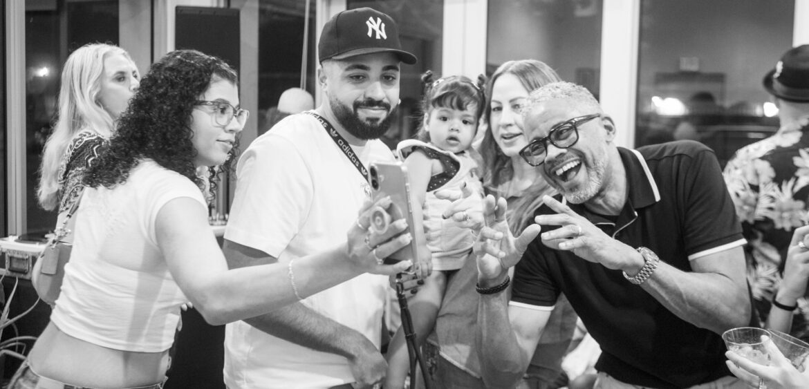 Photographs from the opening night of Carlos Solano’s solo exhibition “An Experience of Us” at WYN317 Gallery in Miami, moving from artwork on the walls and guests in conversation to a salsa jam at Toejam Backlot, ending with Solano painting live.