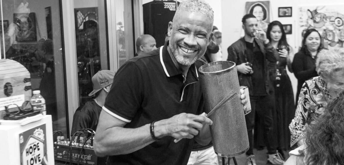 Photographs from the opening night of Carlos Solano’s solo exhibition “An Experience of Us” at WYN317 Gallery in Miami, moving from artwork on the walls and guests in conversation to a salsa jam at Toejam Backlot, ending with Solano painting live.