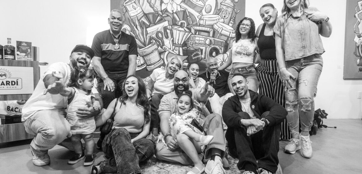 Photographs from the opening night of Carlos Solano’s solo exhibition “An Experience of Us” at WYN317 Gallery in Miami, moving from artwork on the walls and guests in conversation to a salsa jam at Toejam Backlot, ending with Solano painting live.