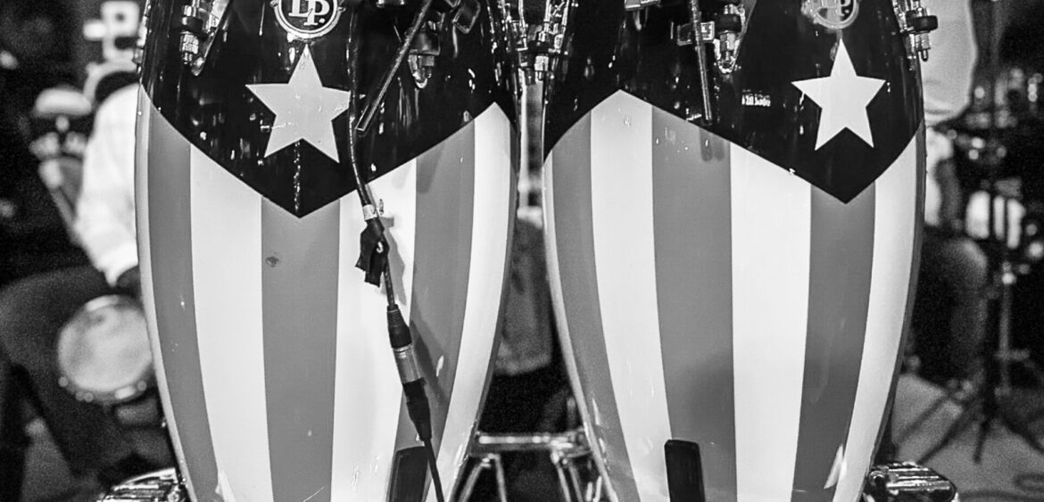 Photographs from the opening night of Carlos Solano’s solo exhibition “An Experience of Us” at WYN317 Gallery in Miami, moving from artwork on the walls and guests in conversation to a salsa jam at Toejam Backlot, ending with Solano painting live.