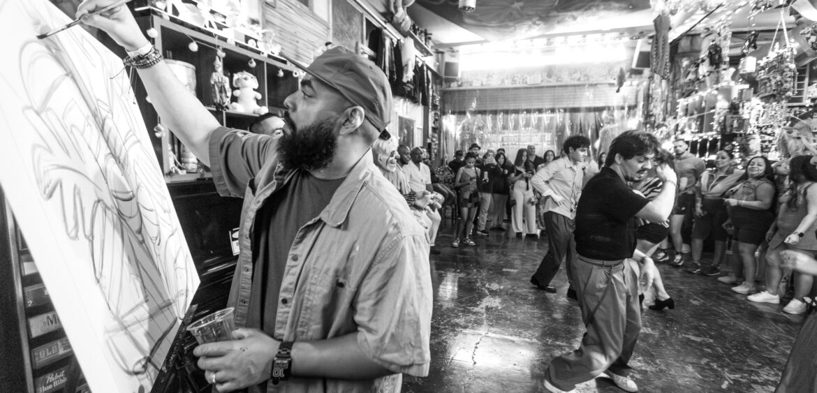 Photographs from the opening night of Carlos Solano’s solo exhibition “An Experience of Us” at WYN317 Gallery in Miami, moving from artwork on the walls and guests in conversation to a salsa jam at Toejam Backlot, ending with Solano painting live.