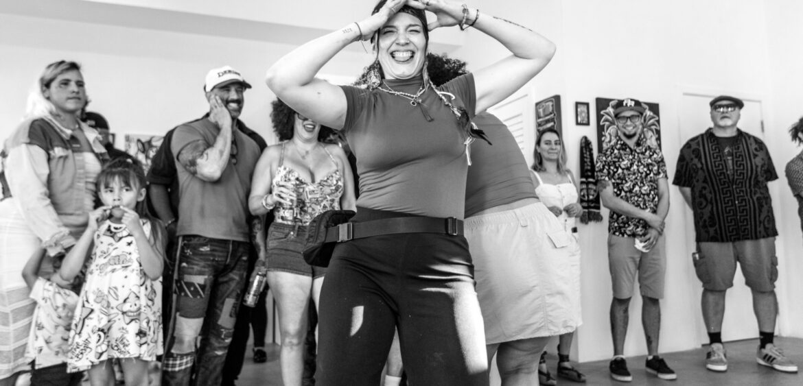 Documentary photograph from Sunset Rumba at WYN317 in Miami, showing live music and gallery activity during the closing reception for Carlos Solano’s exhibition “An Experience of Us.”