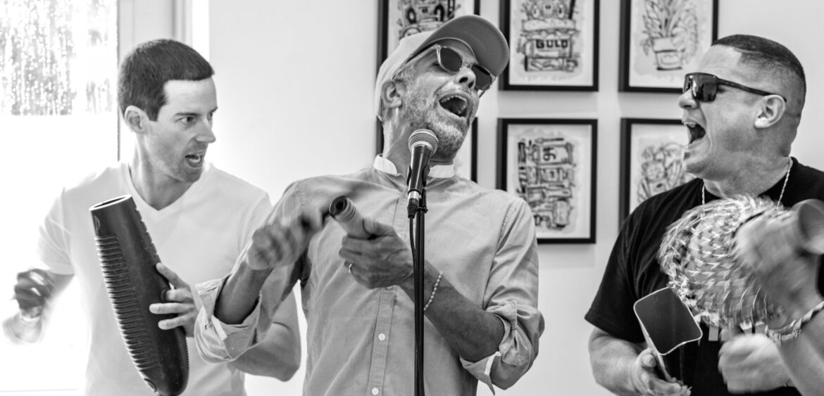 Documentary photograph from Sunset Rumba at WYN317 in Miami, showing live music and gallery activity during the closing reception for Carlos Solano’s exhibition “An Experience of Us.”